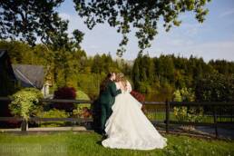 Canada lodge and lake bride and groom portrait