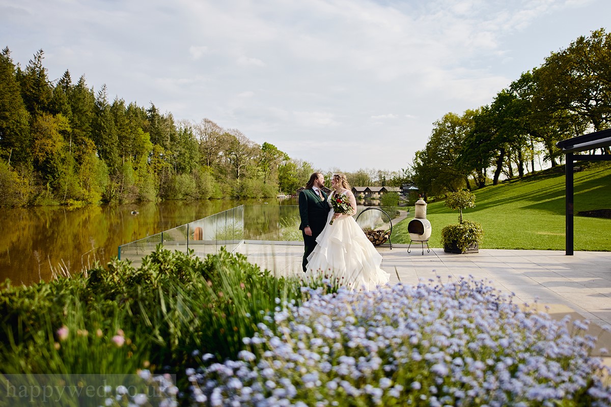 Canada lodge and lake bride and groom portrait