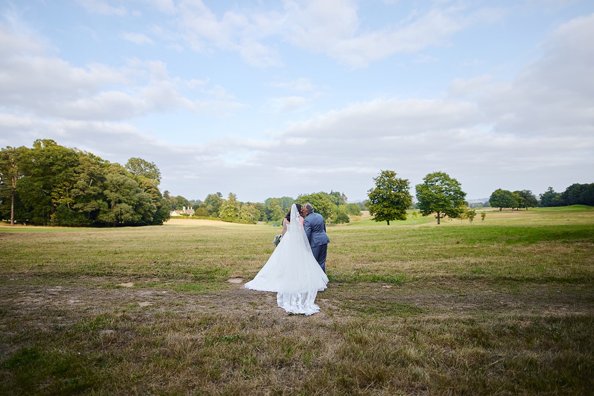 Bride and groom portraits on the scenic golf course at Bowood hotel