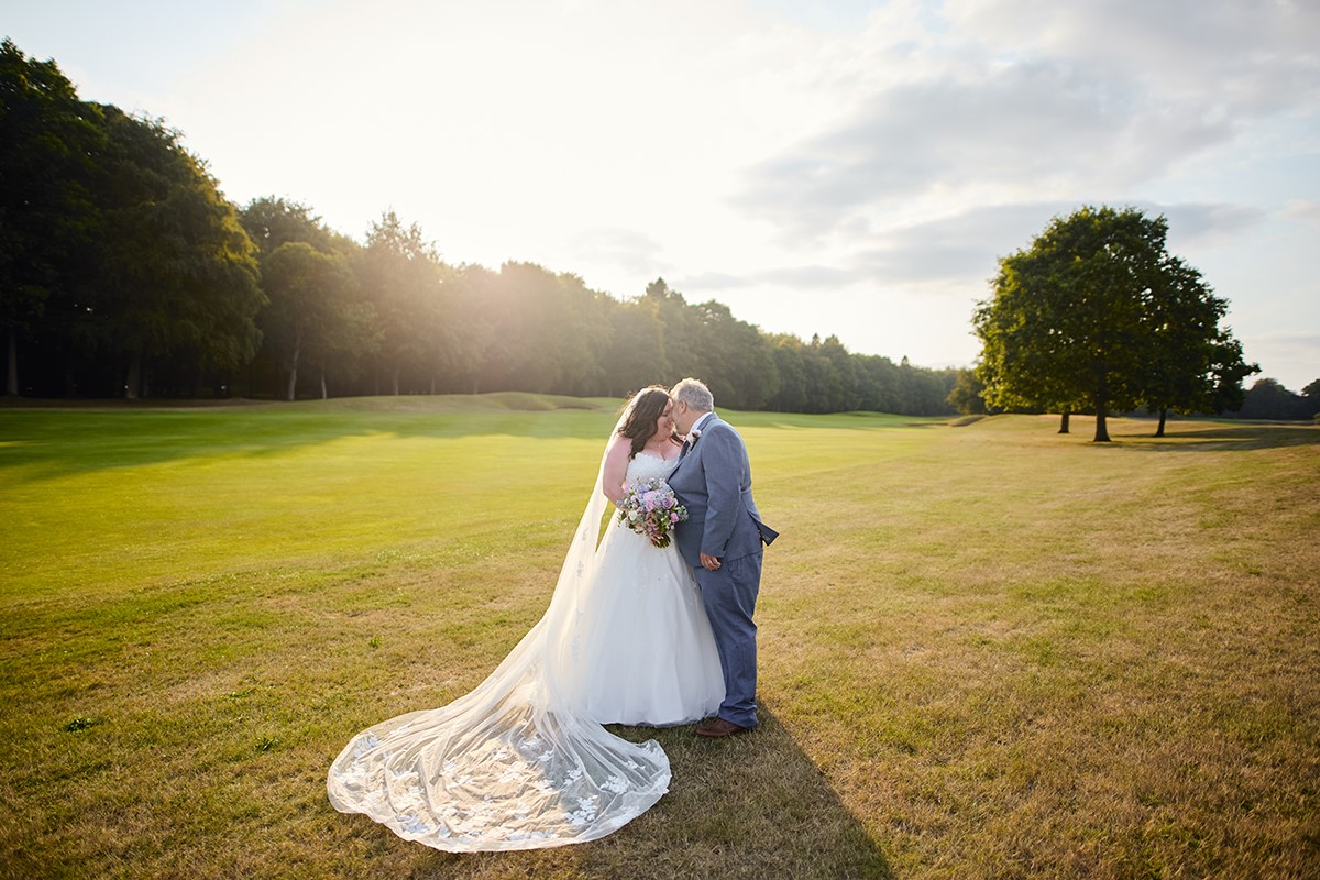 Bride and groom portraits on the scenic golf course at Bowood hotel
