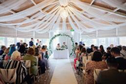 Heritage park hotel wedding ceremony in conservatory